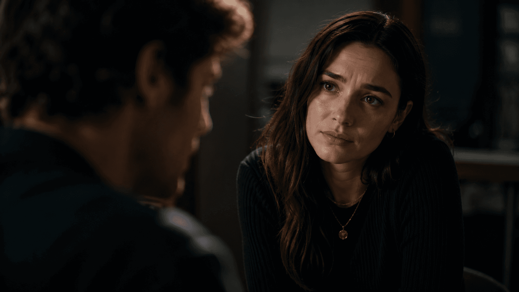 Reaction cut revealing the emotional meaning of a conversation